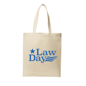 Neutral colored canvas tote with blue Law Day logo